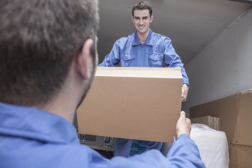 Team coordinating an office relocation with boxes and equipment