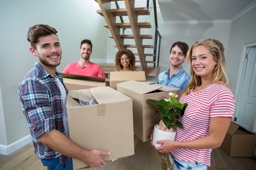 Movers loading boxes for a Swiss apartment relocation