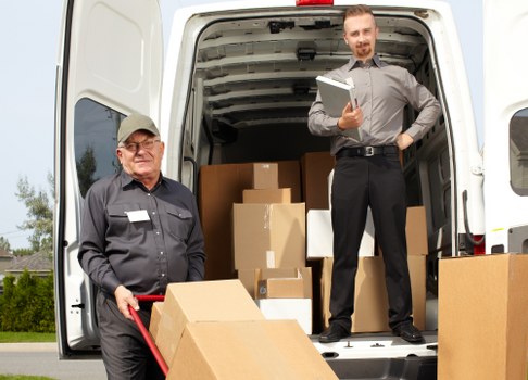Packed moving boxes and furniture prepared for a Switzerland removal