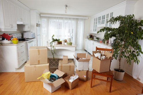 Estimator reviewing cubic-yard pricing for a Swiss house relocation