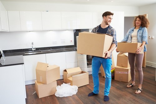 Local movers handling furniture in a Swiss apartment building
