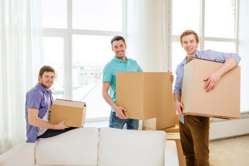 Moving crew preparing boxes for a Swiss residential relocation