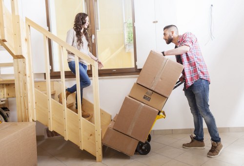 Office relocation with desks, boxes, and equipment in Switzerland