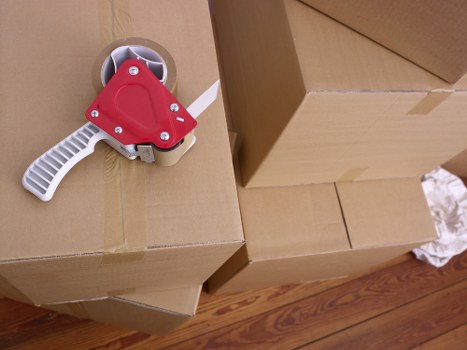 Moving team transporting desks and office furniture into a new Swiss office