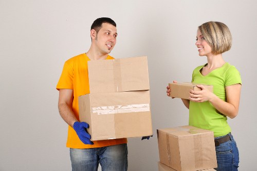 Loading boxes and furniture into a moving van in a Swiss city
