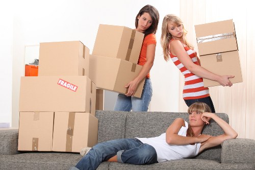 Packed moving boxes and furniture ready for transport in a Swiss apartment move