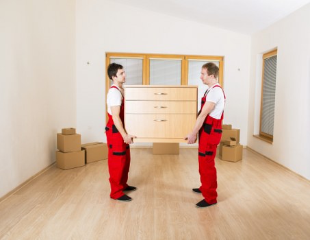 Professional moving team preparing furniture for transport in Switzerland